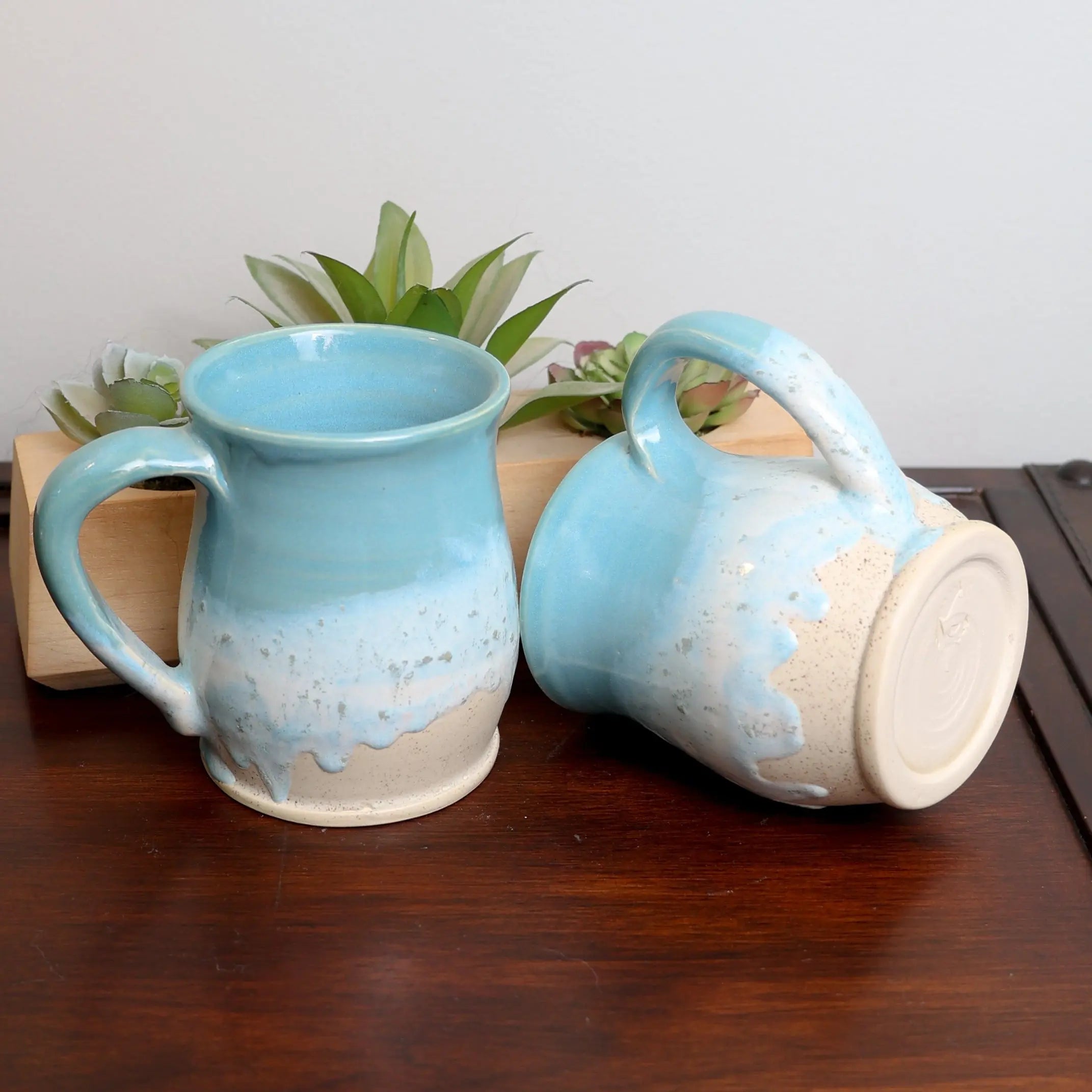 Artisan handmade ocean coffee mug with swirling blue glaze