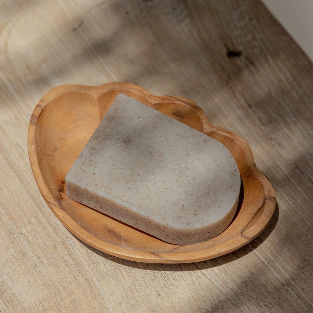 Coastal teak shell decorative dish with a sculptural natural wood finish.