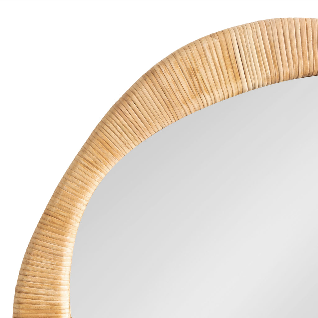 Coastal woven wall mirror with a distinctive organic silhouette.