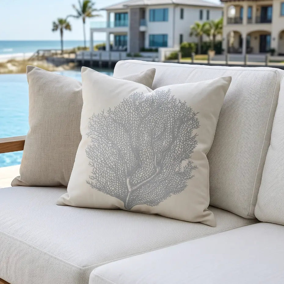 Coral indoor outdoor throw pillow with coral reef pattern for coastal decor.