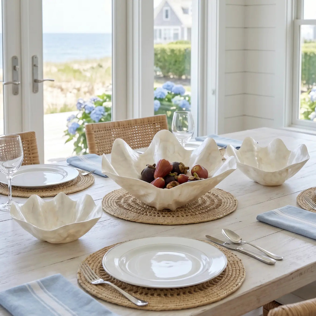 Iridescent clam shell bowls with natural pearl finish on a coffee table