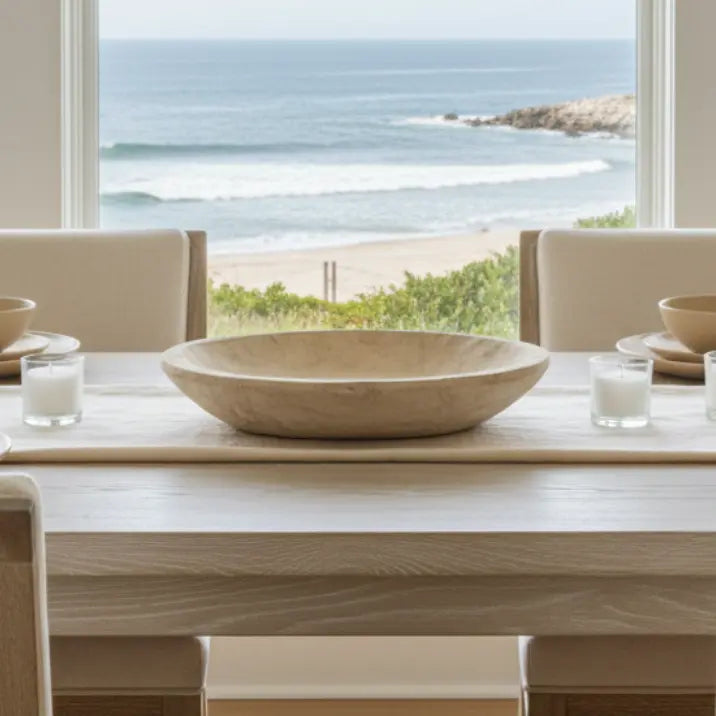 Palomino wood bowl on a dining table with an ocean view backdrop