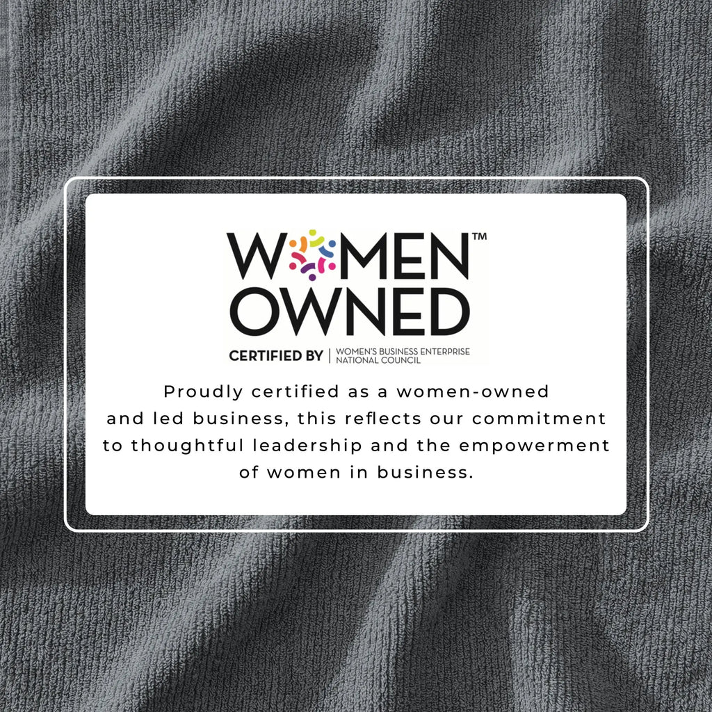 Bath towel set with Women Owned certification badge on grey ribbed fabric