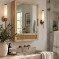 Elegant coastal mirror medicine cabinet with natural wood, woven rattan, and hidden bathroom storage