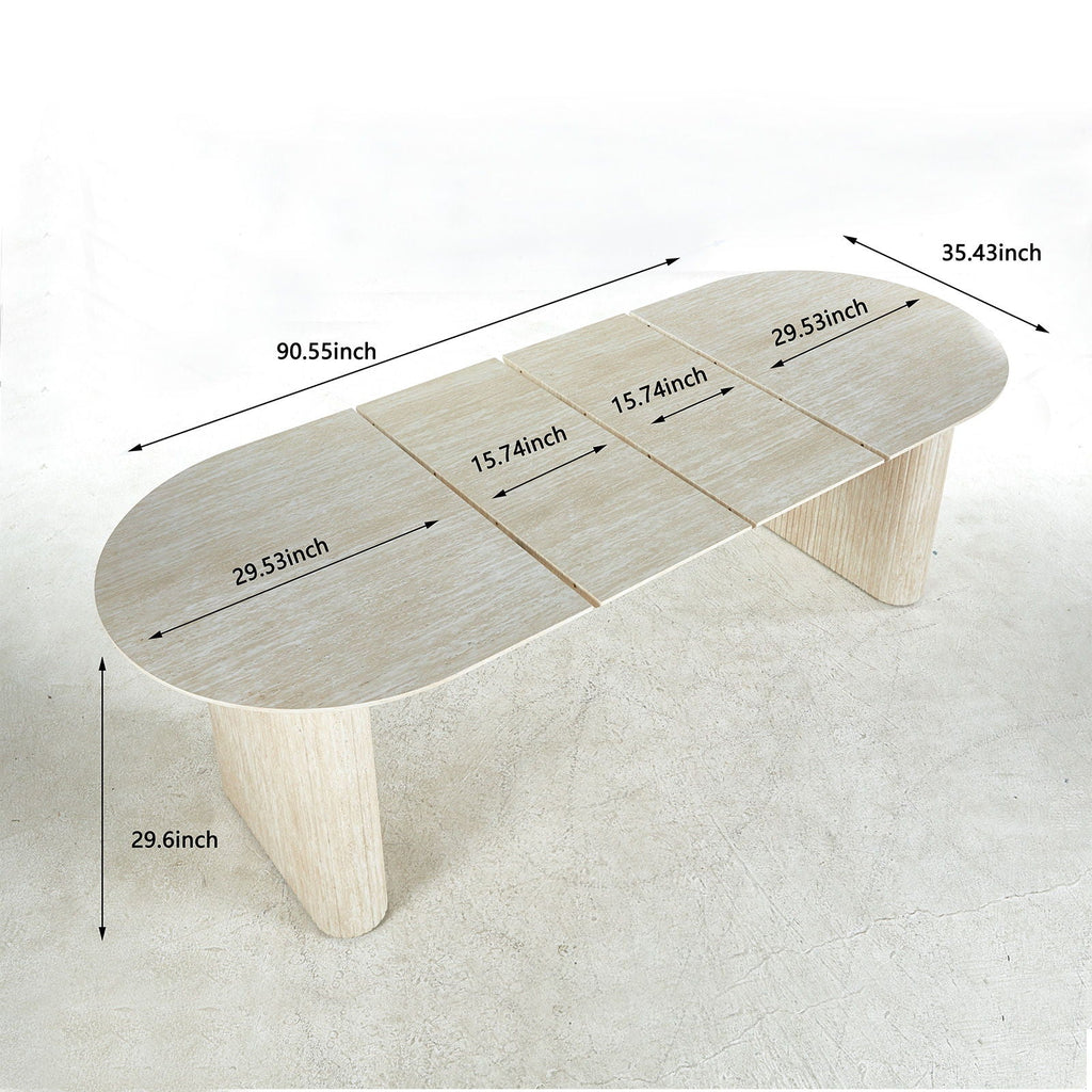 Elegant coastal oval dining table with a natural wood finish and softly fluted double pedestal base