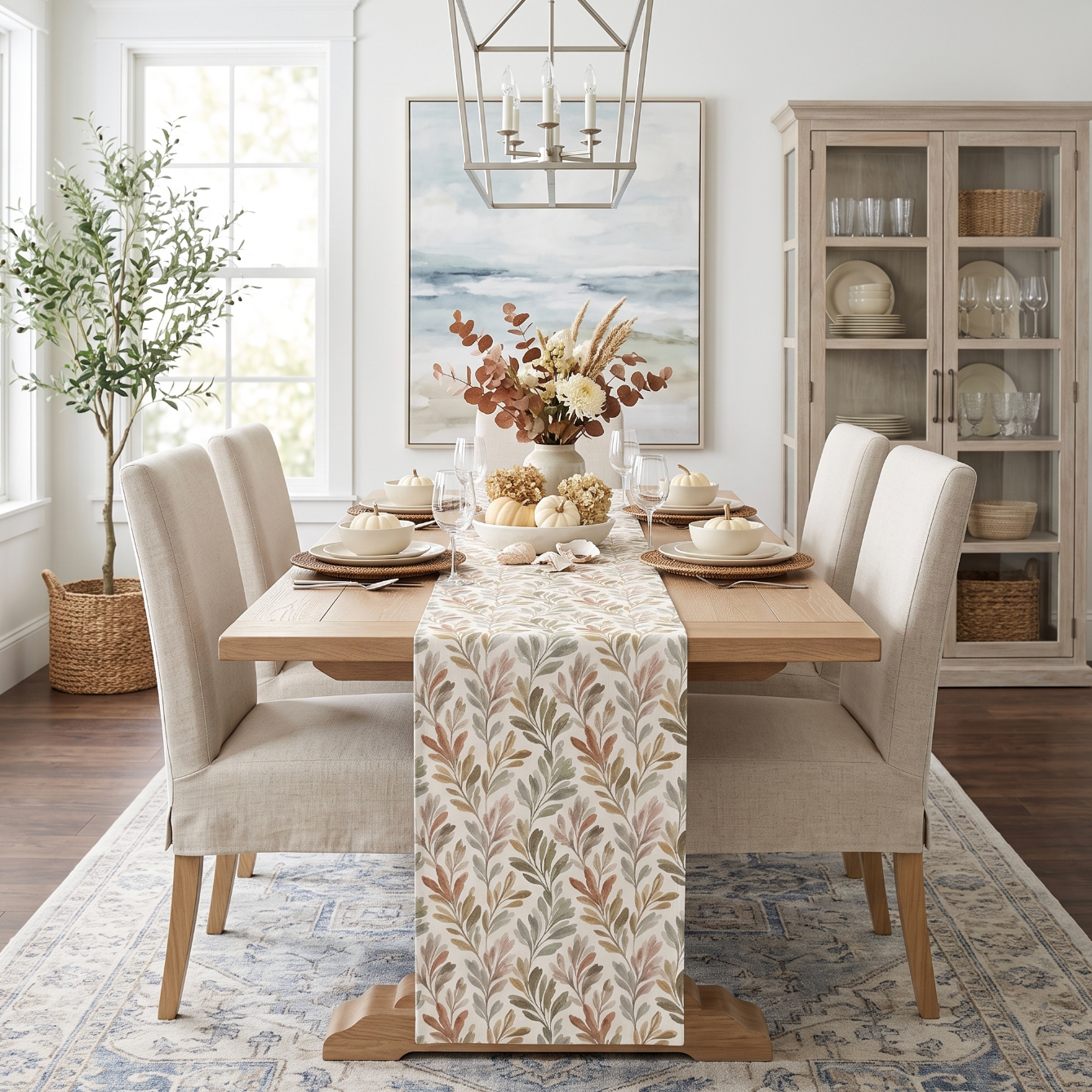 Botanical olive grove runner creating a warm Mediterranean-inspired Thanksgiving table setting.
