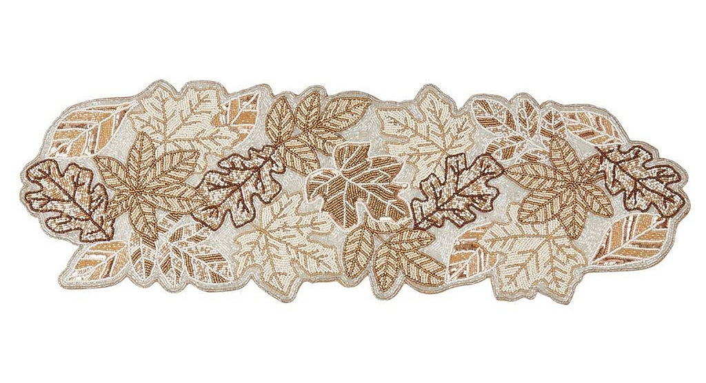 Neutral fall leaf table runner styled on an autumn dining table