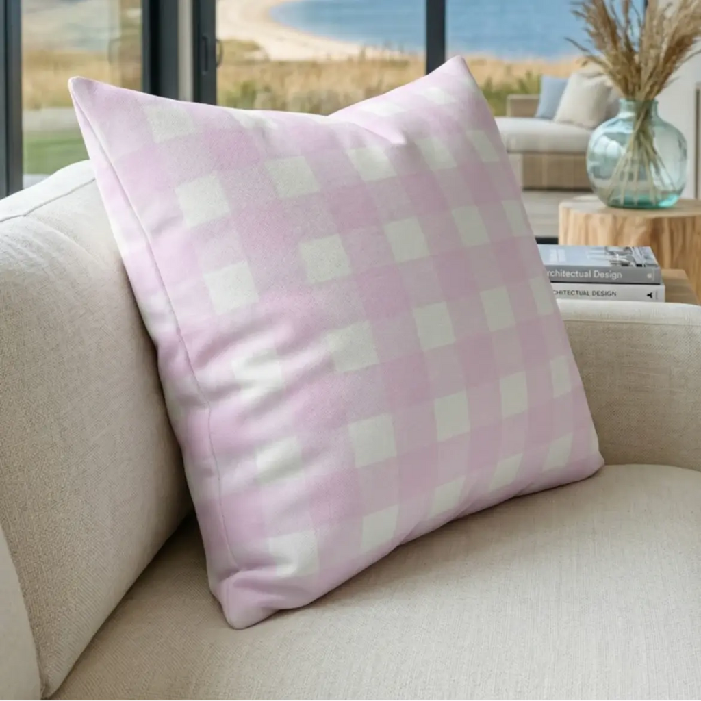 Lila Throw Pillow, pink and white gingham check on a beige sofa.