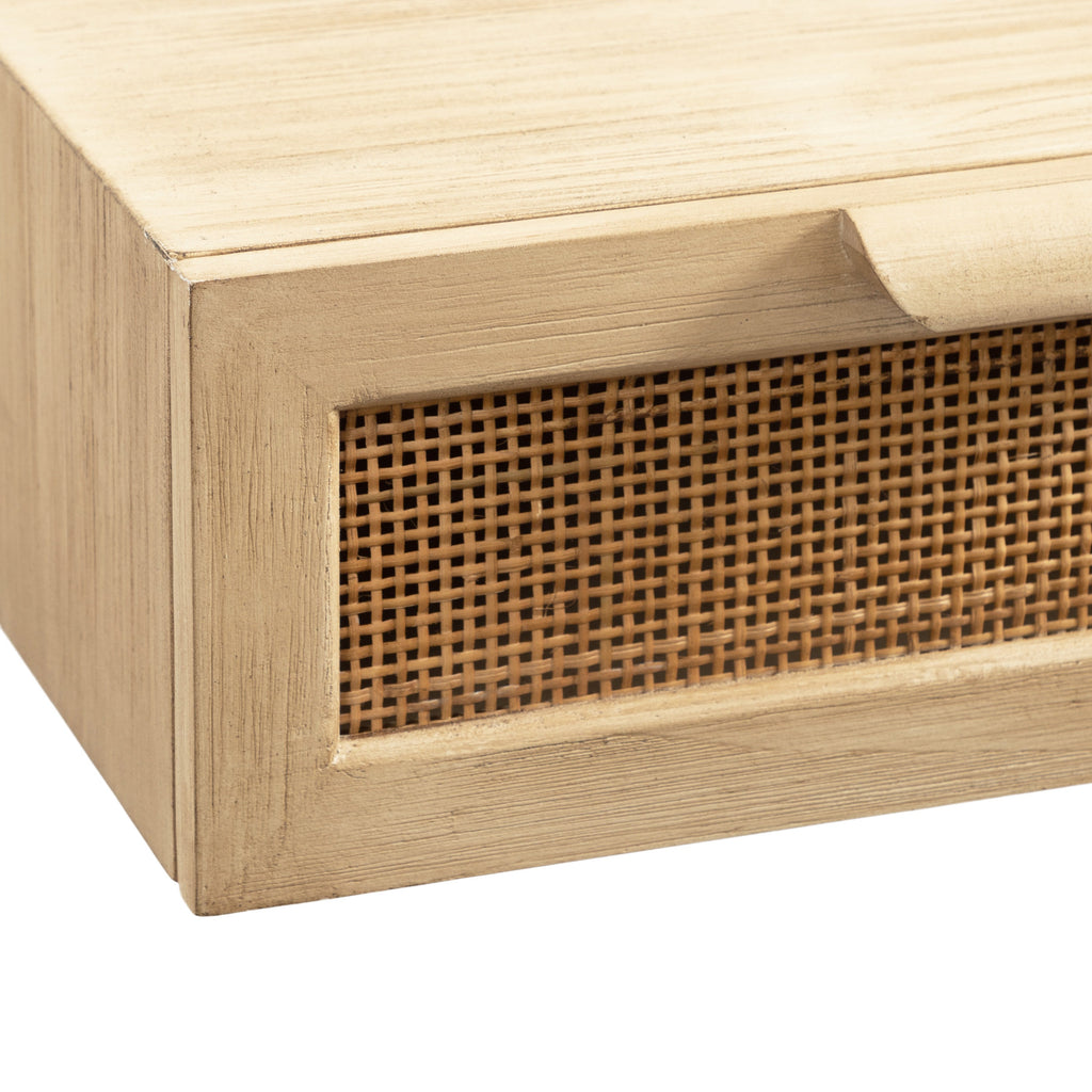 Floating entryway table in a light natural wood finish with woven cane panel drawers
