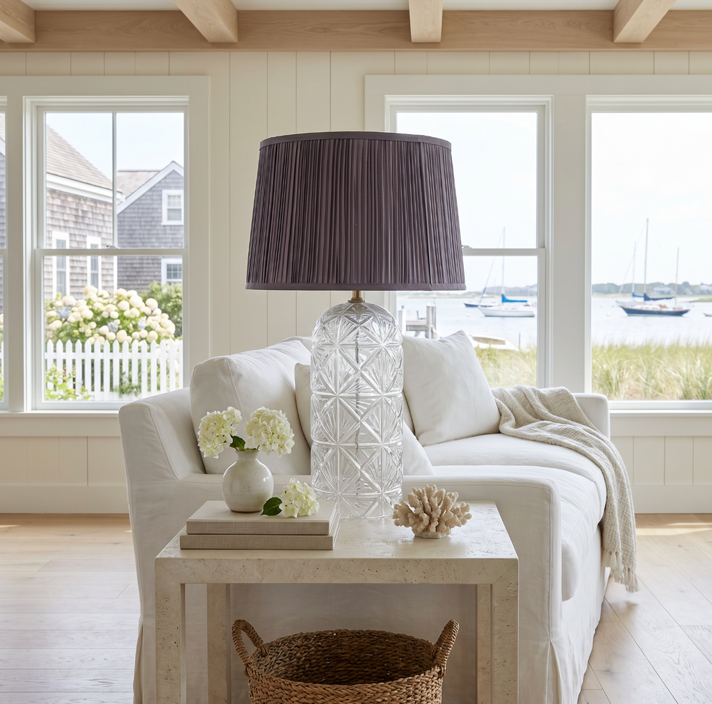Glass accent lamp with a woven shade for organic modern interiors.