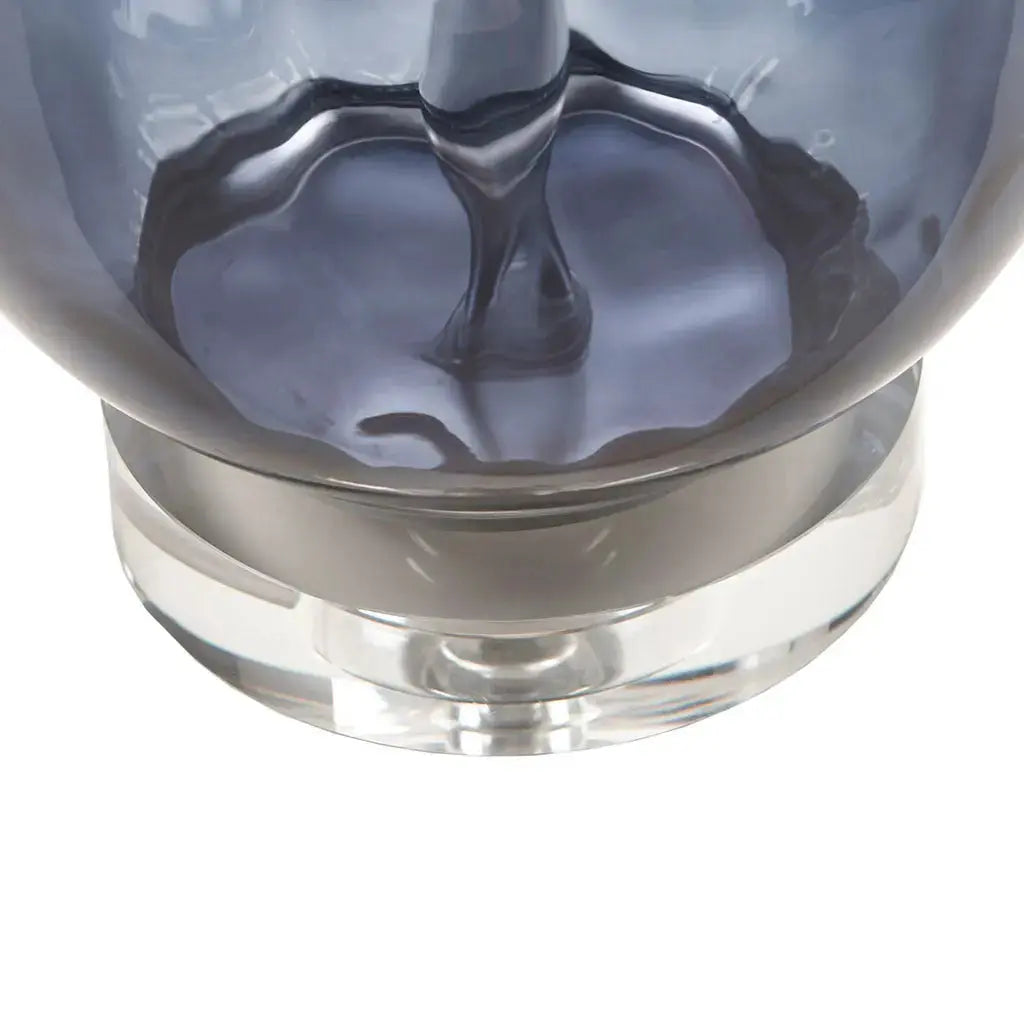 Artisan-inspired blue glass lamp with subtle tonal variation