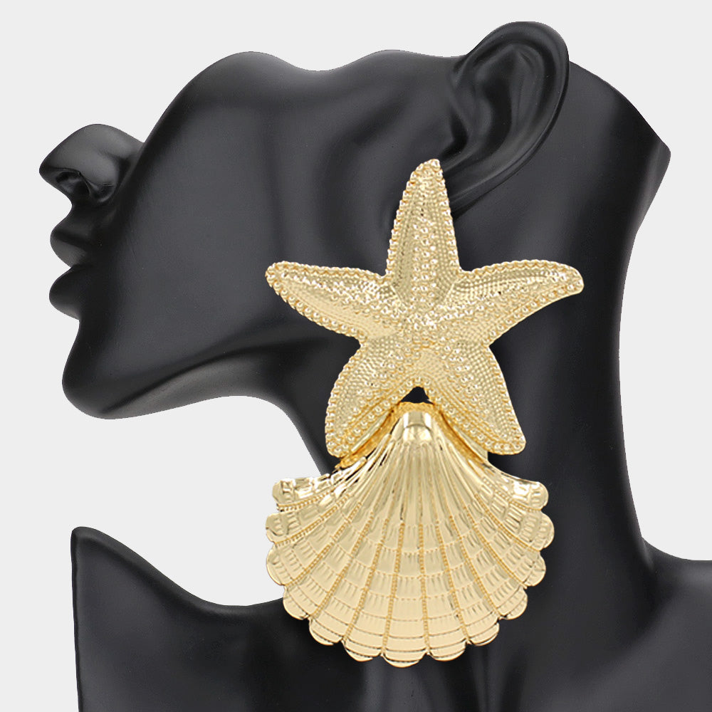 Gold starfish statement dangle earrings displayed as beach vacation jewelry