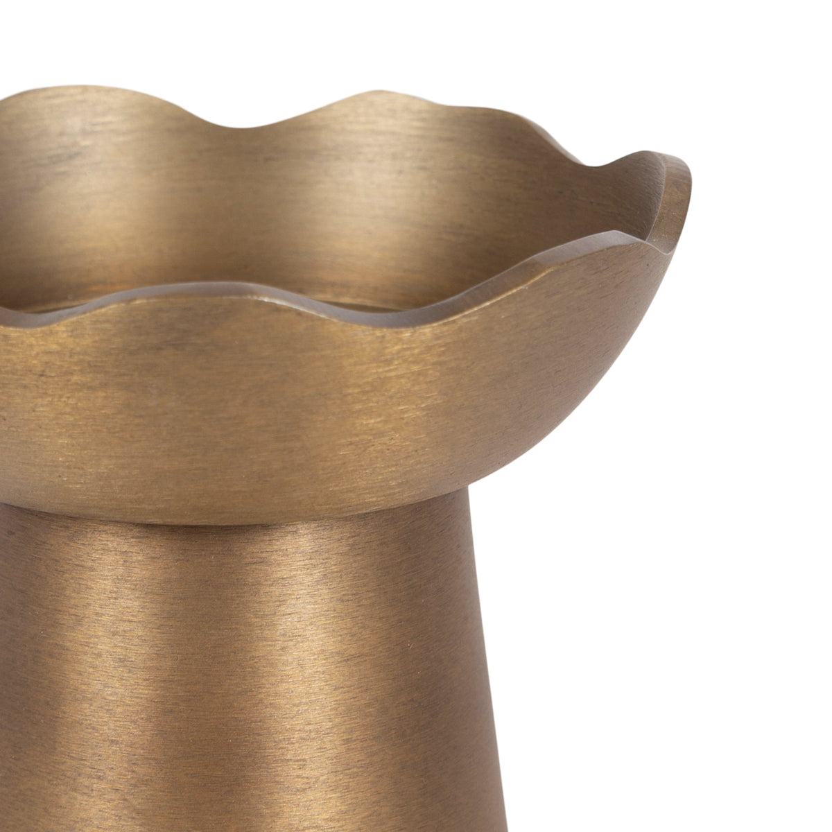 Gold wavy candle holders styled as an elegant decorative set.