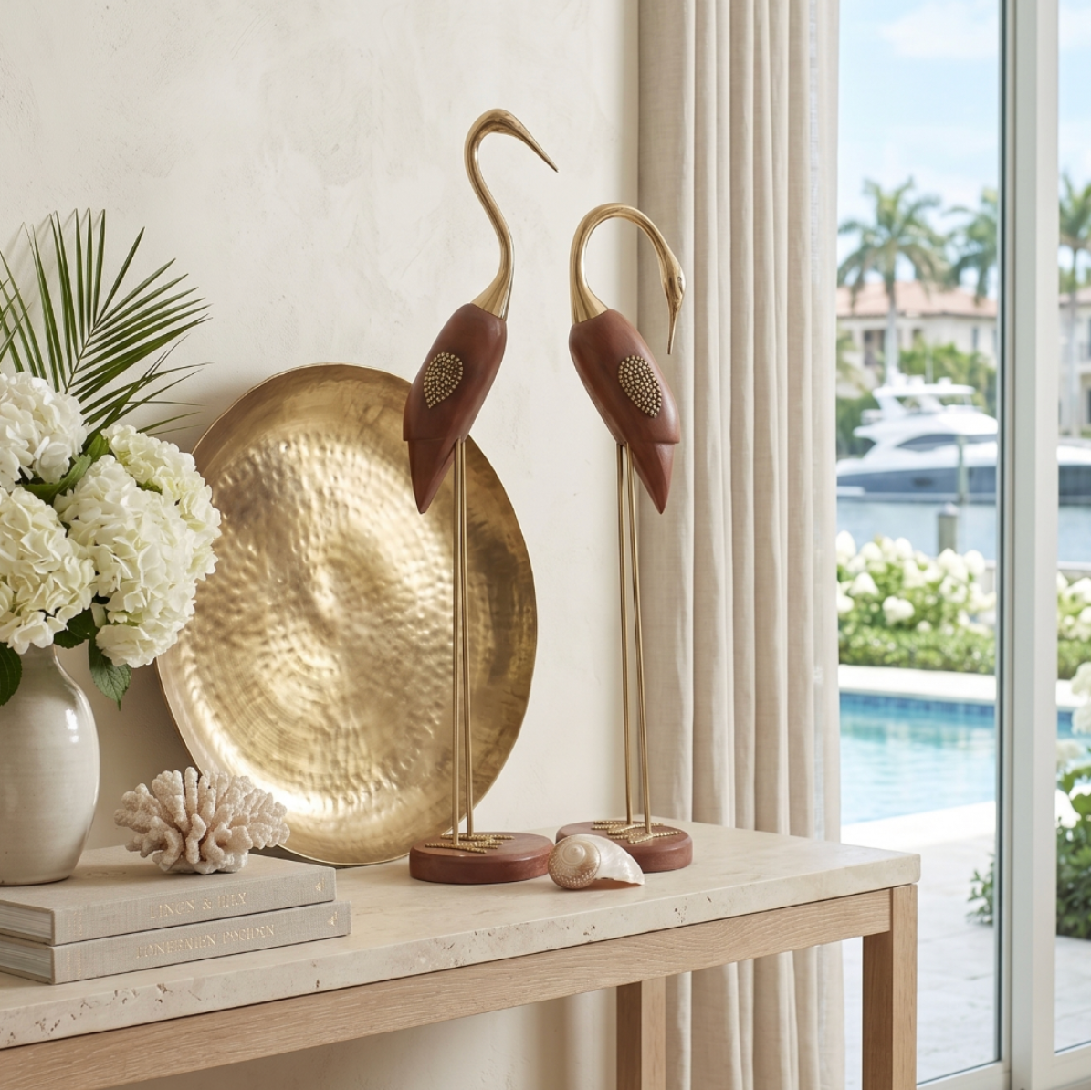 Gold wood bird sculpture styled on a console table as a modern home decor accent