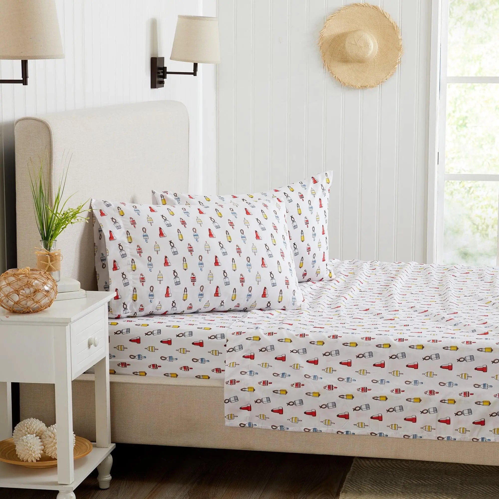 Coastal Sheet Set Nantucket Collection by Great Bay Home; white sheets with a colorful nautical print.