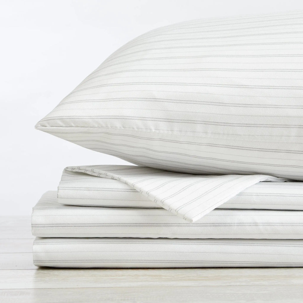 Stripe Sheet Set - Adeline Collection by Great Bay Home, white with thin gray stripes, folded on a stack.