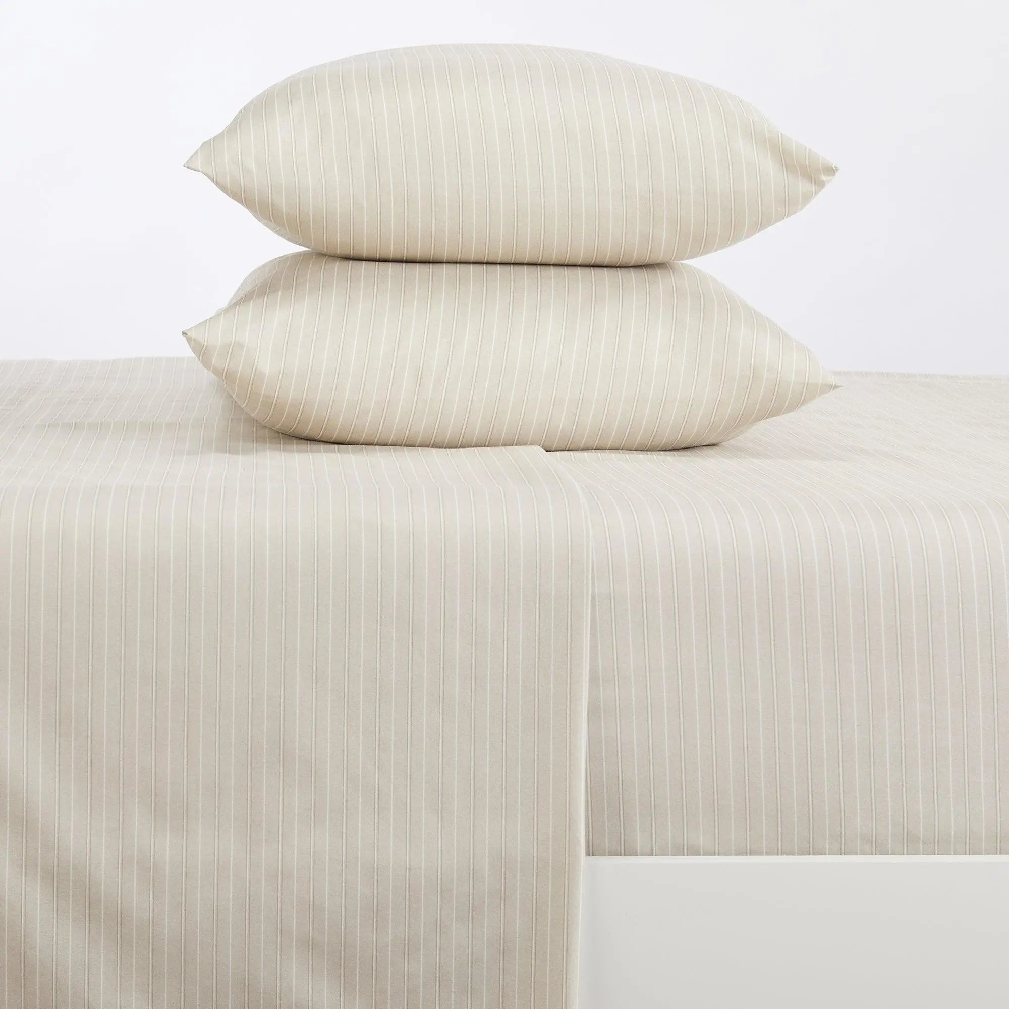 Stripe Sheet Set, Adeline Collection by Great Bay Home; beige with white vertical stripes on bed with 2 matching pillows