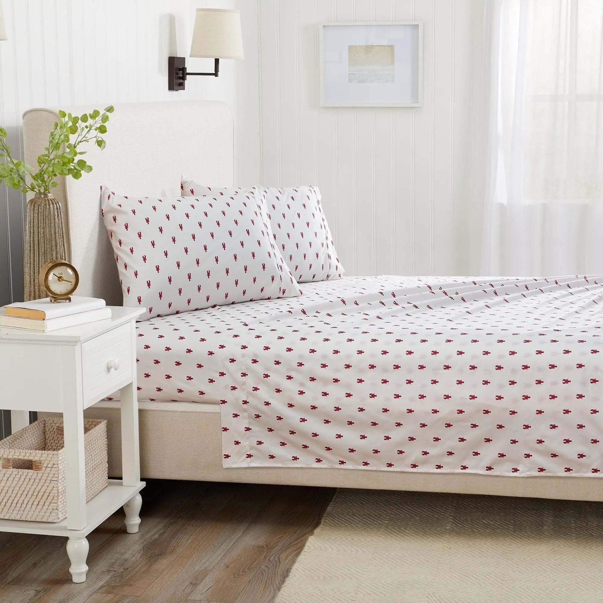 Coastal Sheet Set - Nantucket Collection by Great Bay Home on a white bed with a small red nautical pattern.