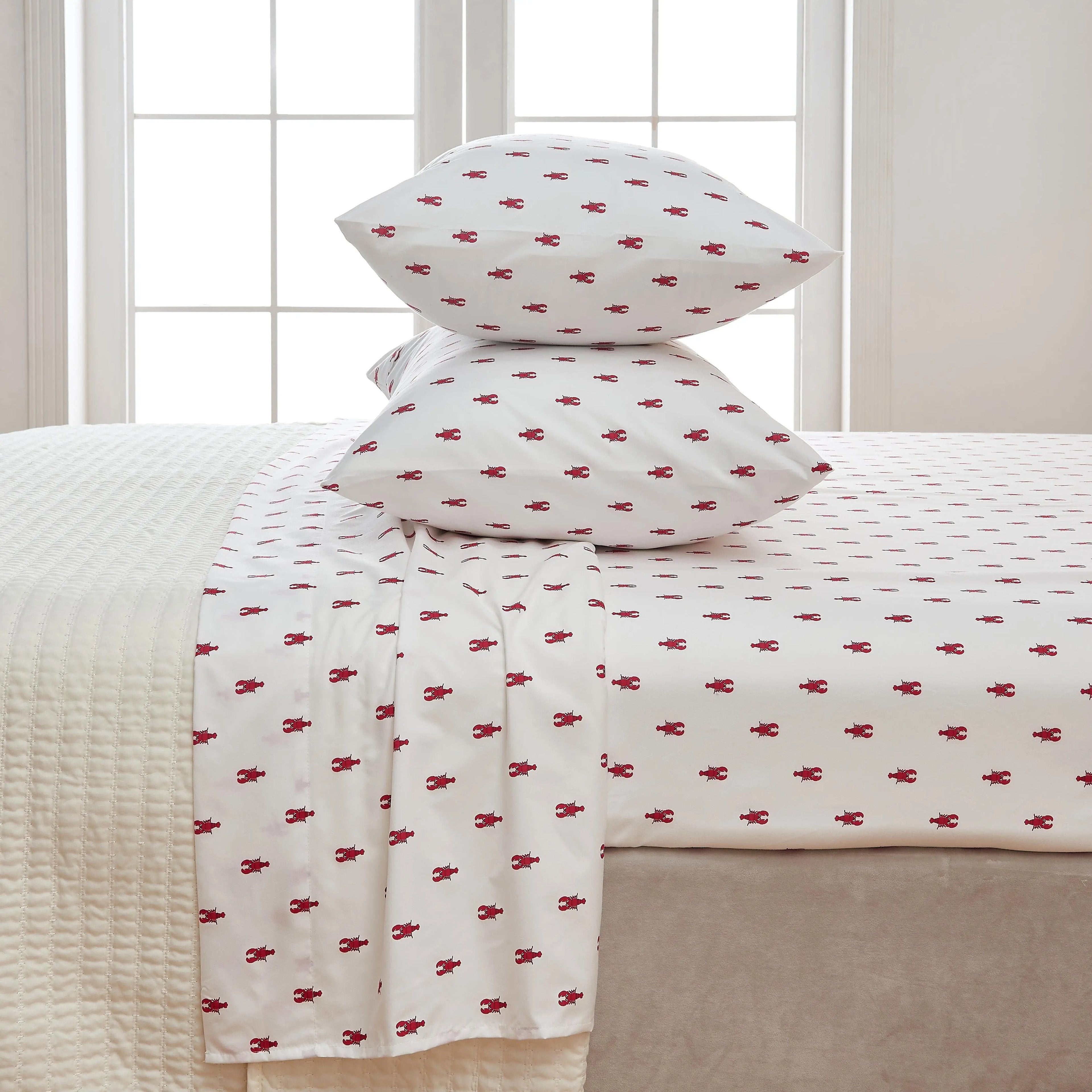 Coastal sheet set by Great Bay Home, Nantucket Collection; white with small red lobster print.