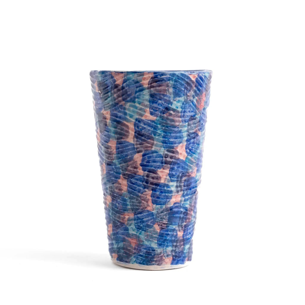 Detail of textured coastal design on green and blue tumblers.