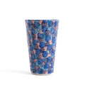 Detail of textured coastal design on green and blue tumblers.