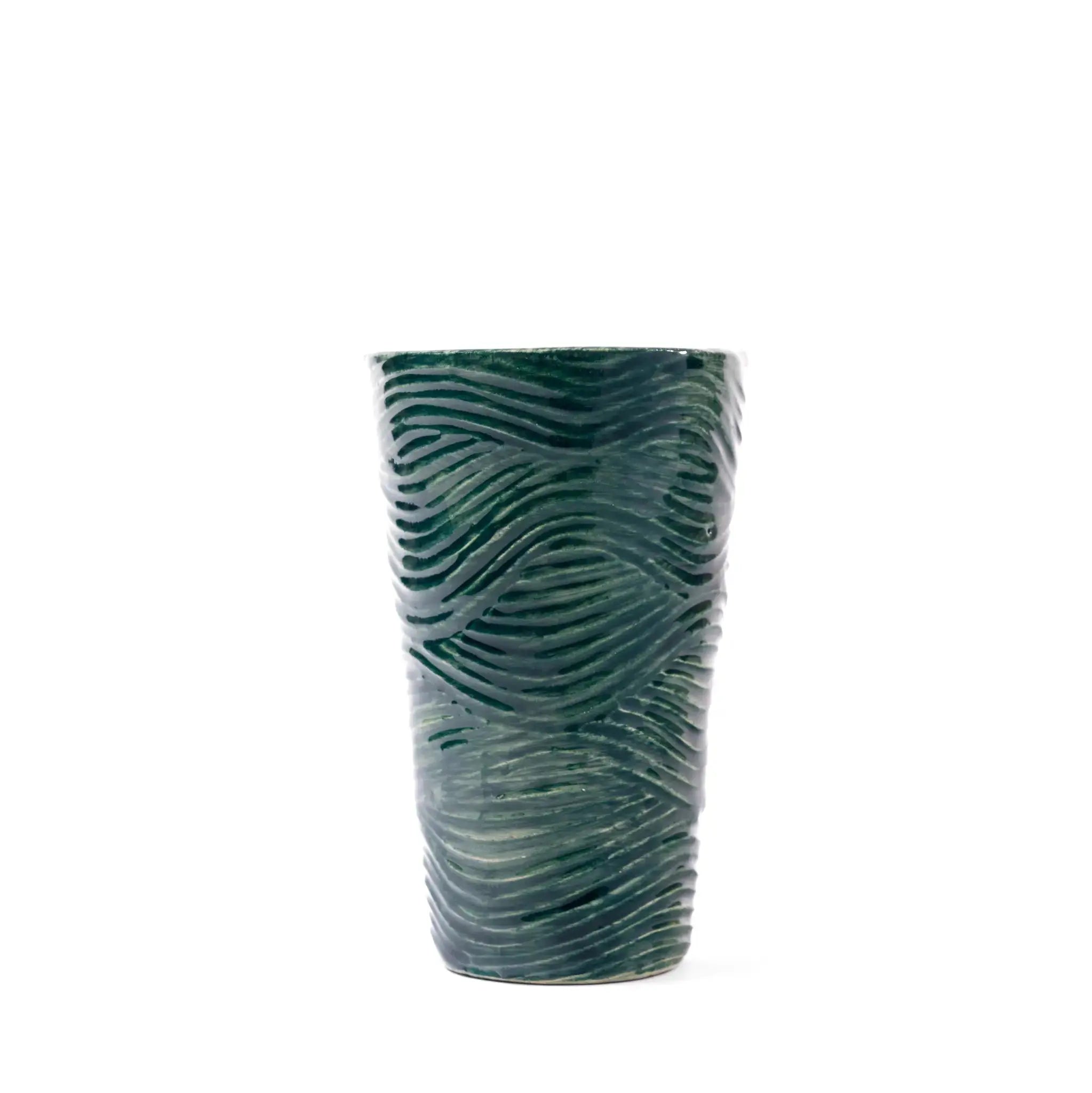 Detail of textured coastal design on green and blue tumblers.