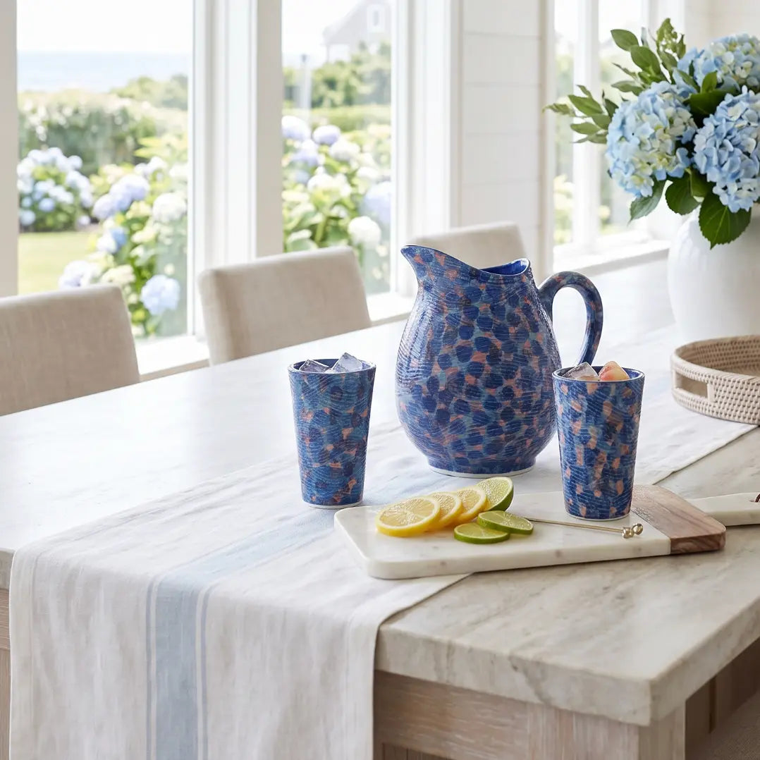 Green and blue coastal tumblers with ocean-inspired patterns, glassware set.