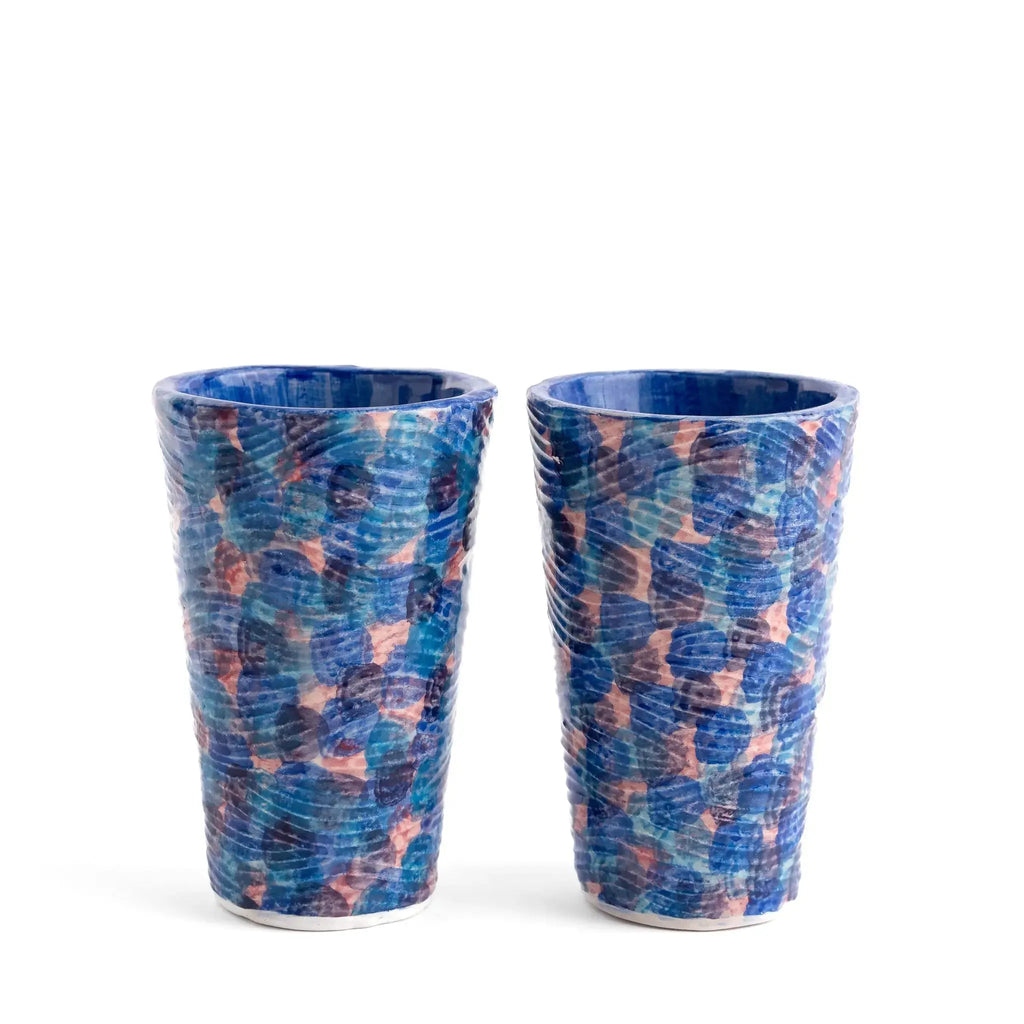 Blue coastal pattern glass tumbler used for water or cocktails.