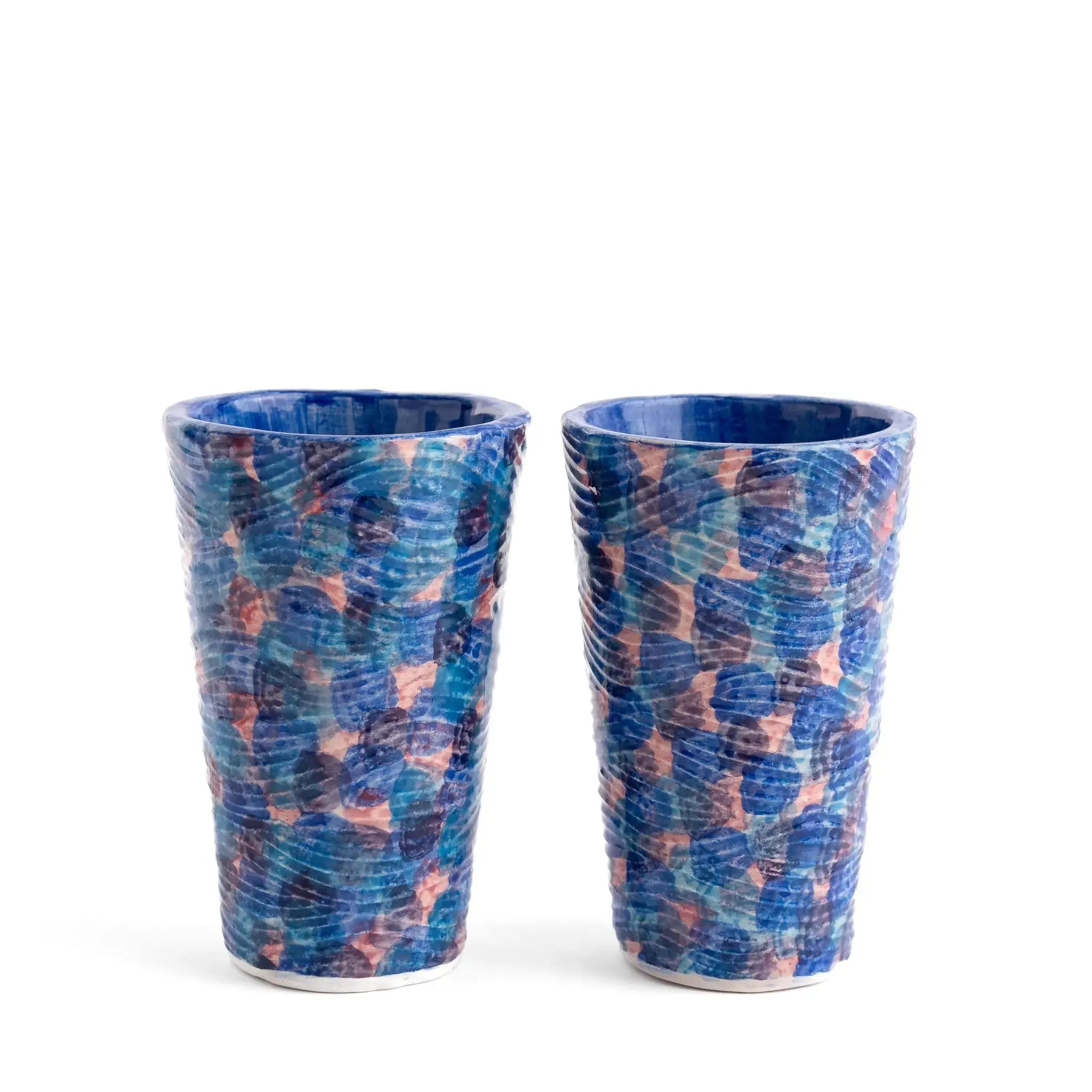 Blue coastal pattern glass tumbler used for water or cocktails.