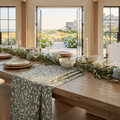 green and white flower pattern table runner styled for a farmhouse coastal dining table