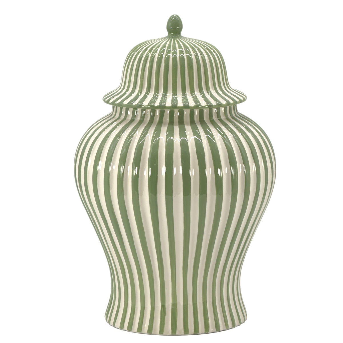 Close-up of the glossy green and white candy cane-inspired stripes on a ceramic decorative vase.