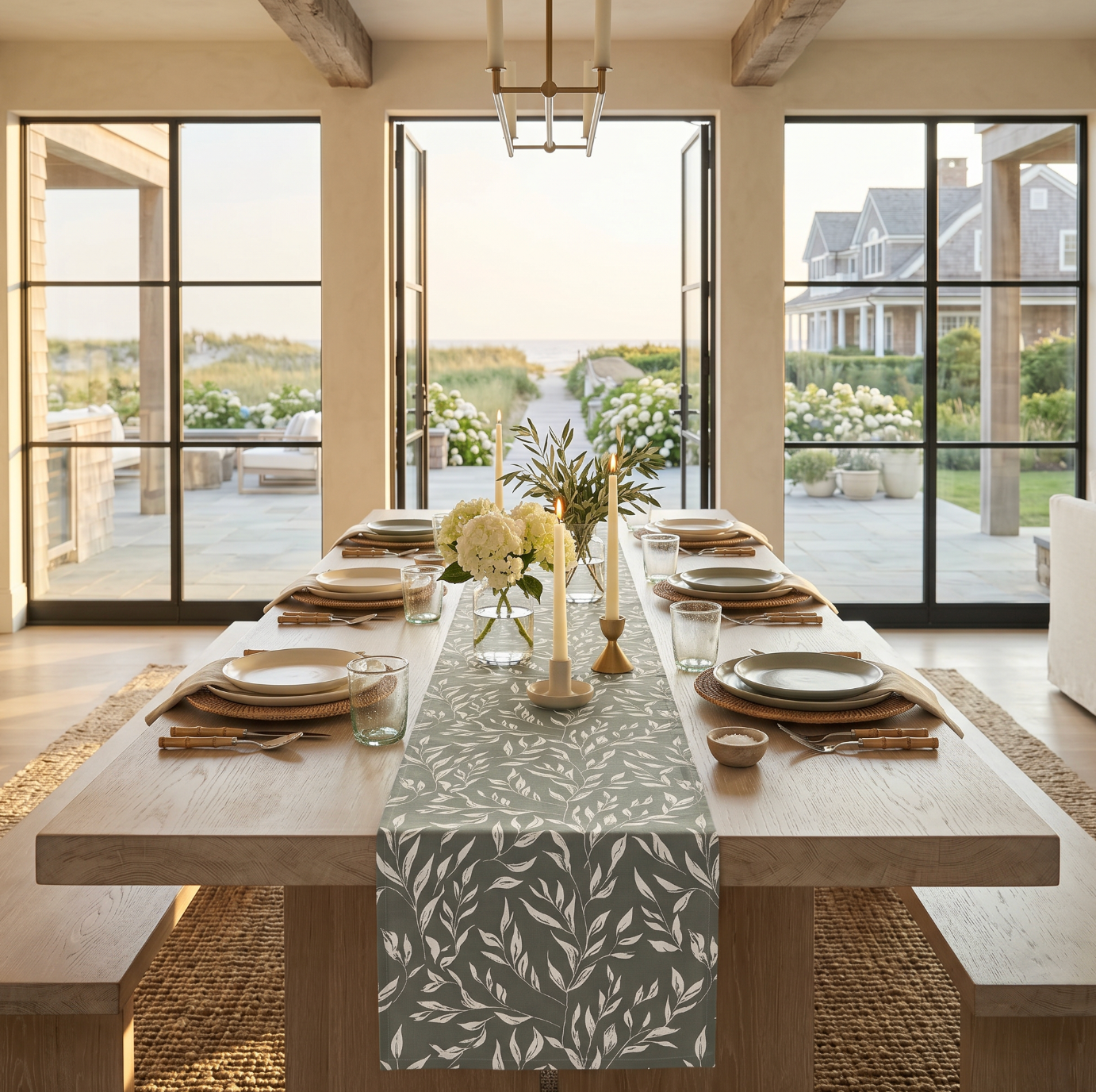 Green and white floral table runner on a natural wood dining table with neutral place settings