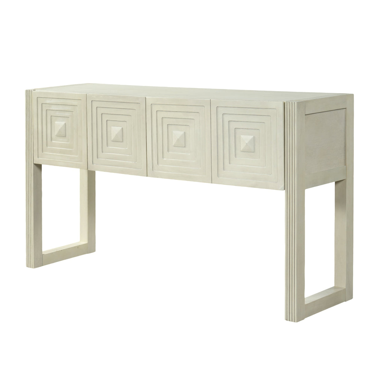 Geometric carved console table styled in an elegant Hamptons-inspired coastal entryway.