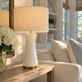 White table lamp with gold accents inspired by Hamptons coastal interiors.