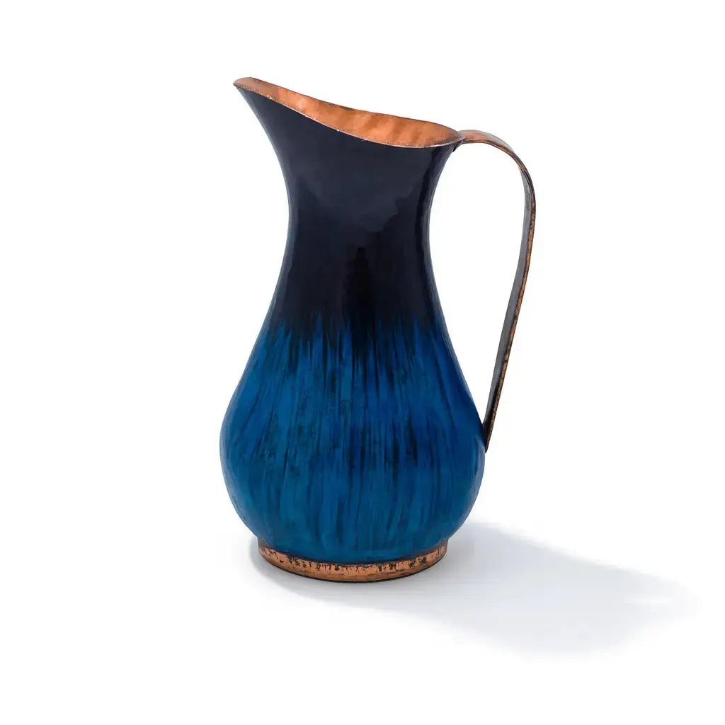 Tall handblown blue glass pitcher, coastal-inspired tabletop accent