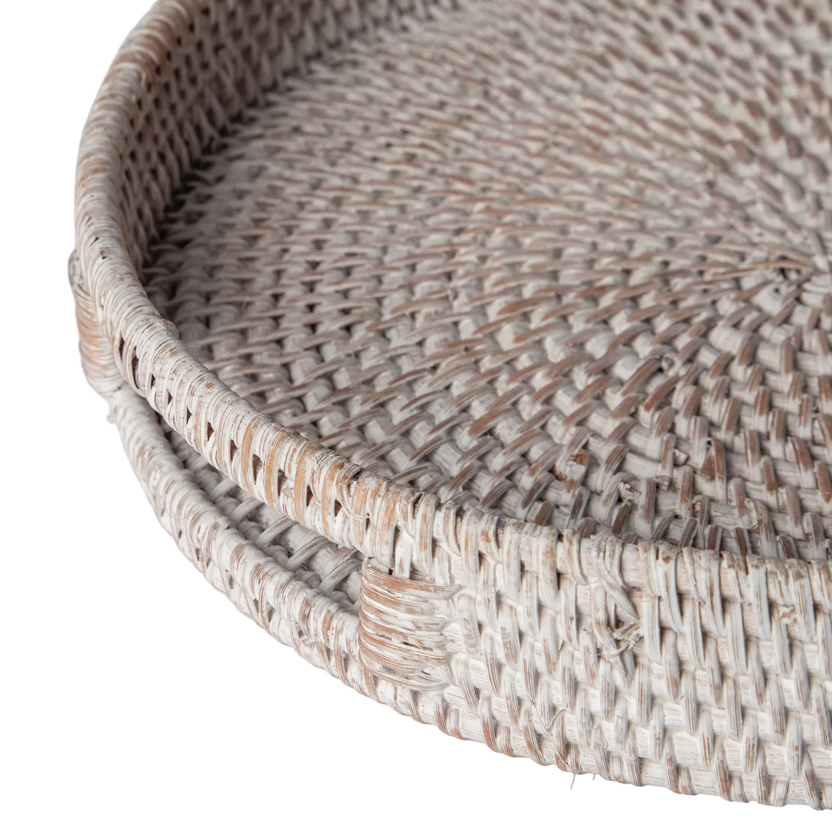Coastal-style rattan ottoman tray with a light whitewash finish and tapered woven sides