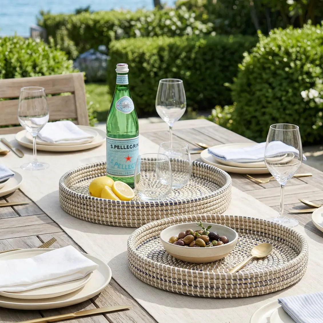 Handwoven seagrass coastal tray with natural texture and blue undertones, eco-friendly serving tray
