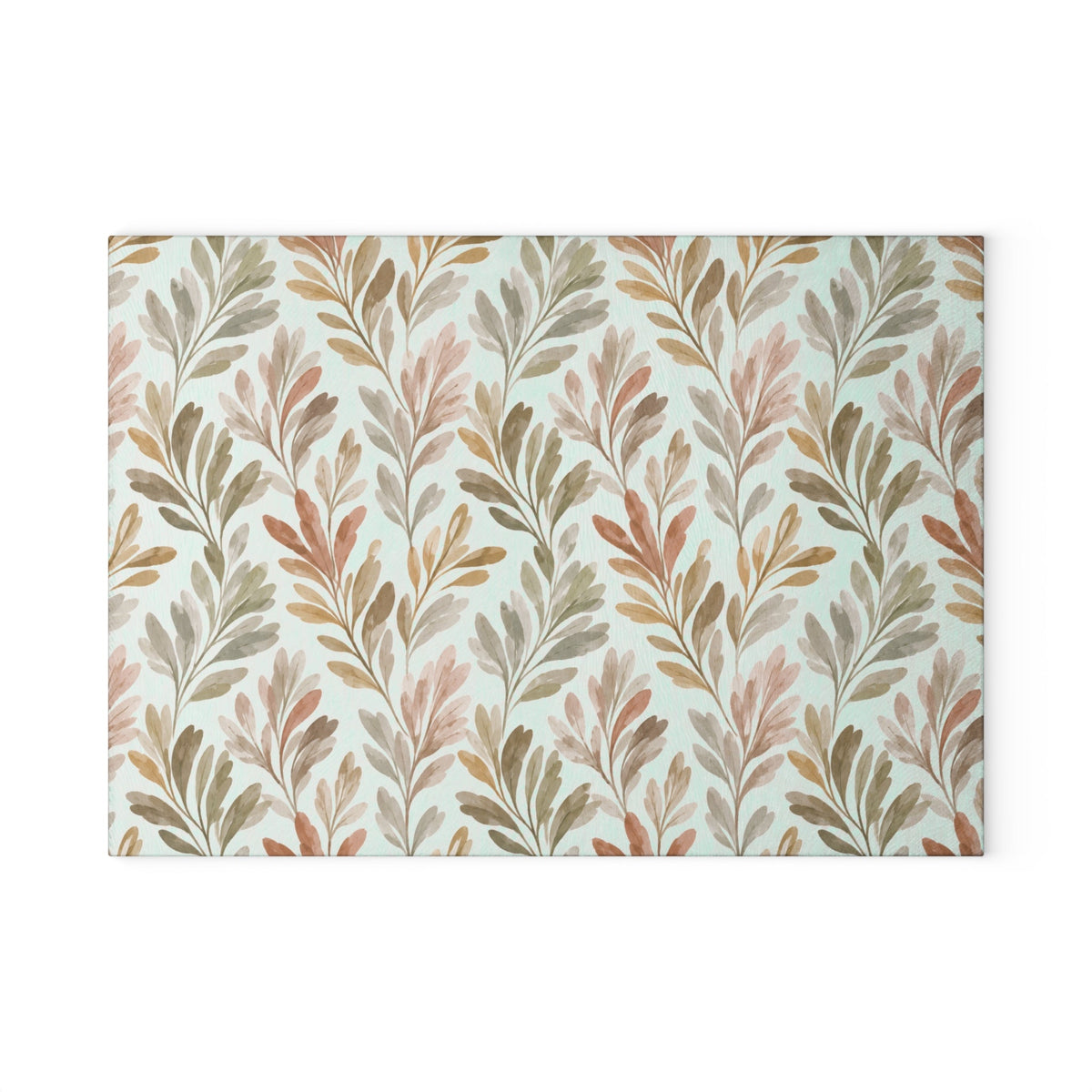 Fall leaf pattern glass cutting board in muted earth tones for autumn kitchen styling
