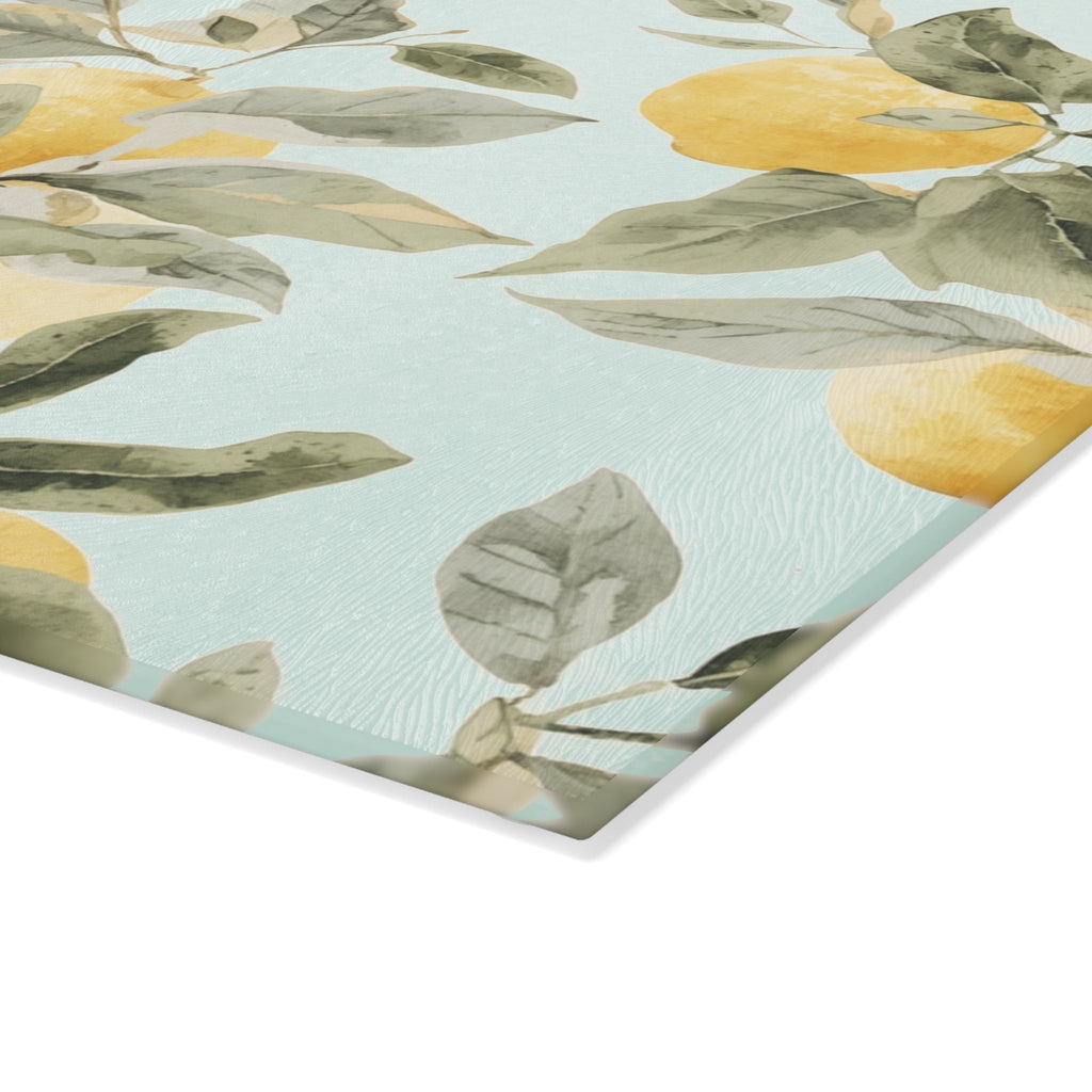 Lemon citrus glass cutting board and serving board styled as a summer cheese and charcuterie tray in a bright kitchen