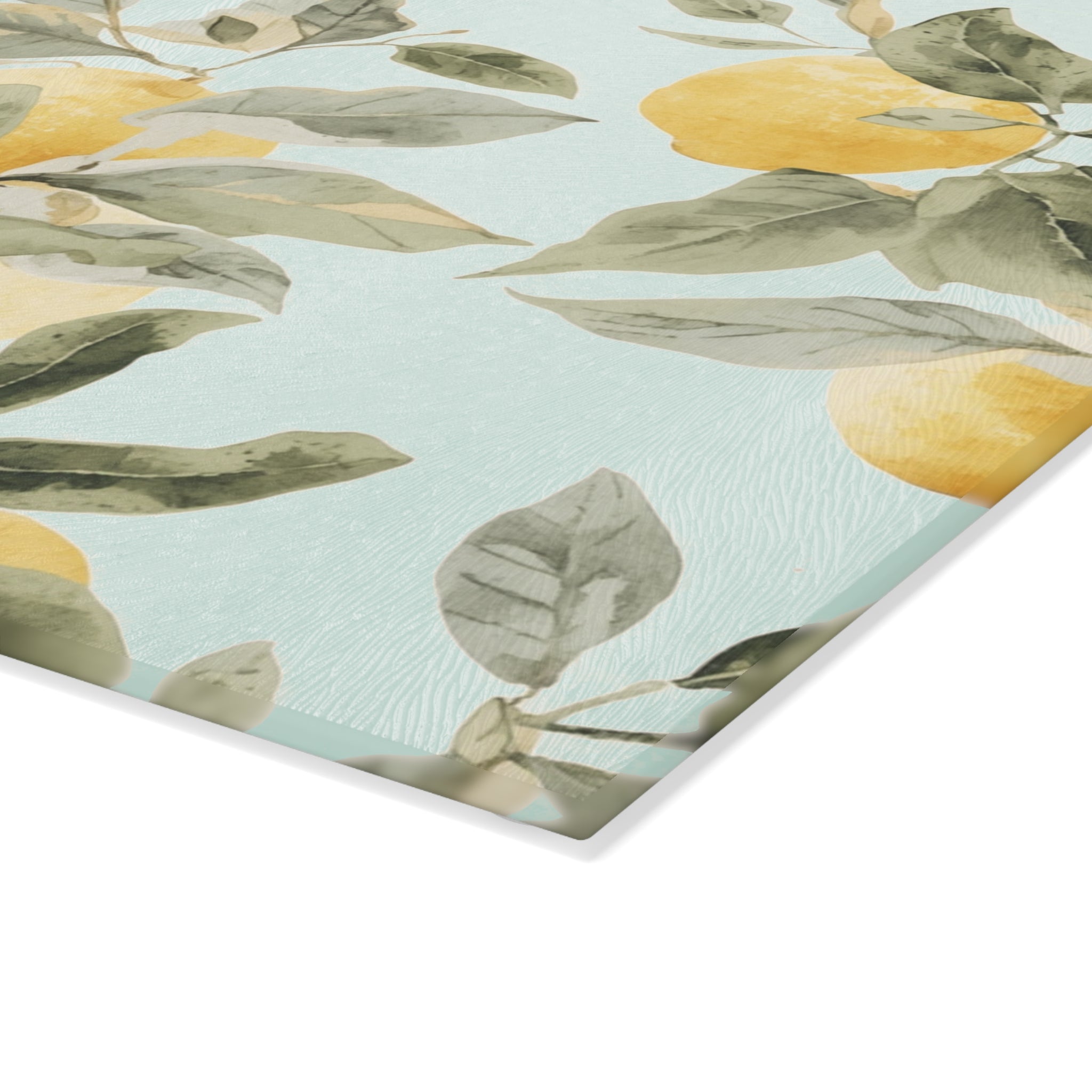 Lemon citrus glass cutting board and serving board styled as a summer cheese and charcuterie tray in a bright kitchen