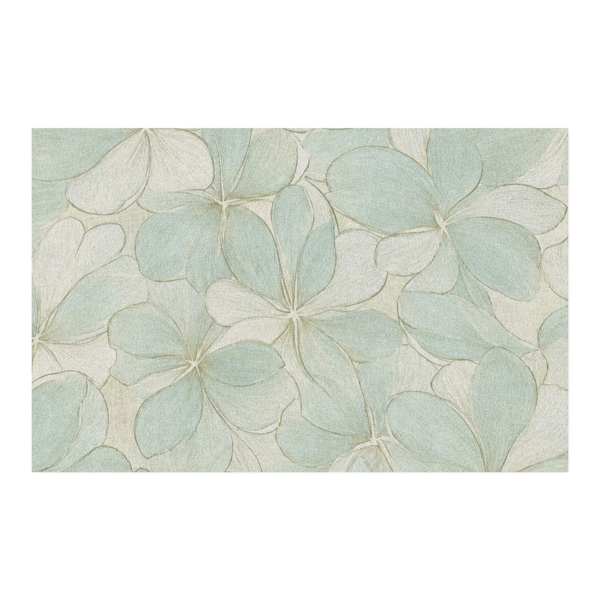 Large‑scale floral area rug in pale aqua tones that anchors a calm, modern coastal room.
