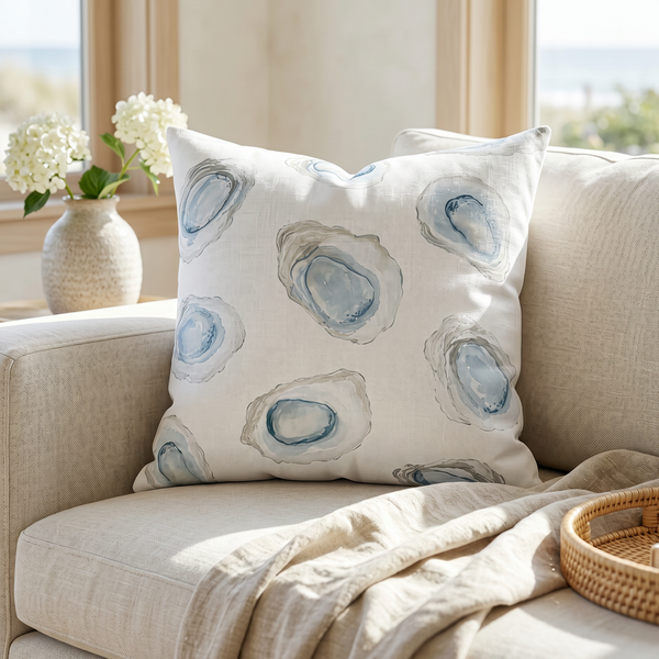 light blue throw pillow cover with white oyster shell pattern for coastal couch or bed decor