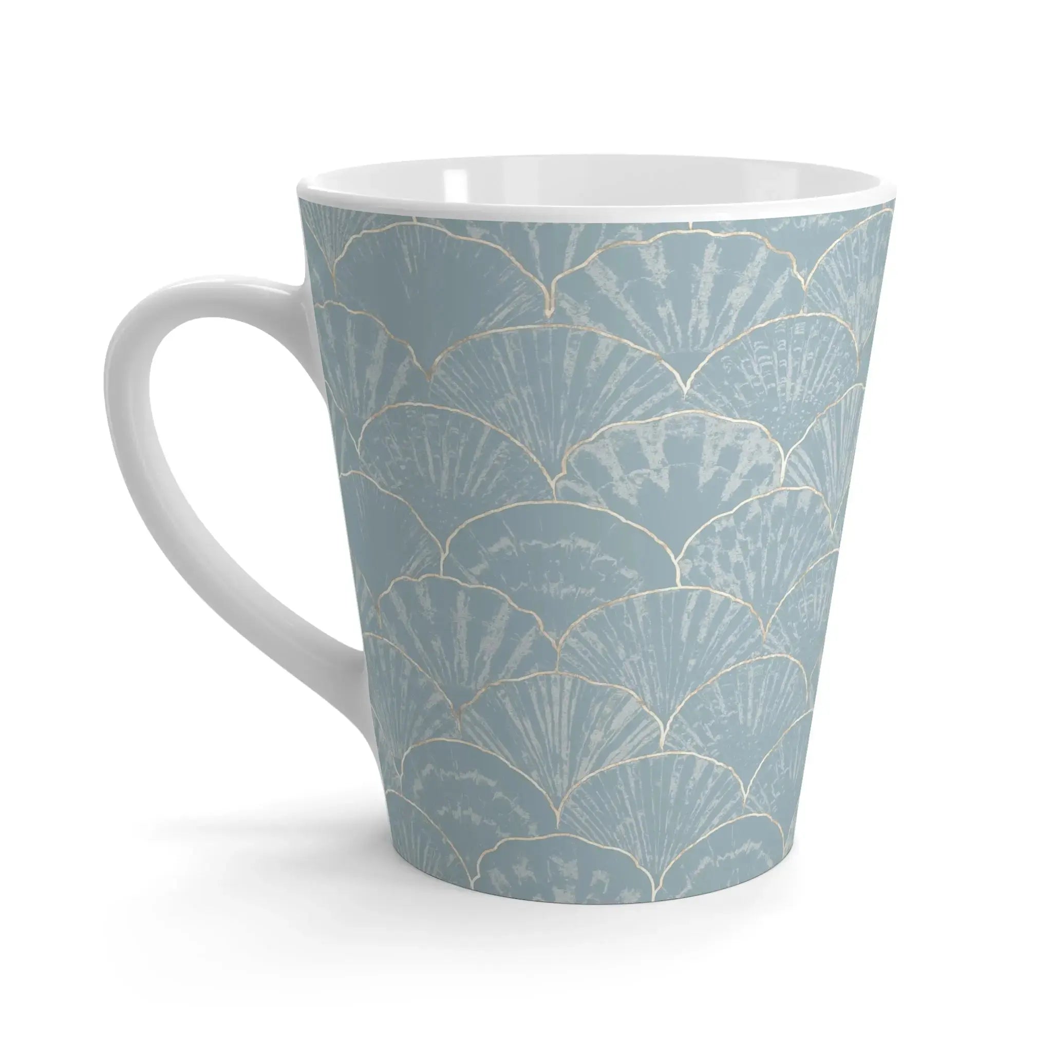 Closeup of blue seashell pattern on light blue ceramic coffee mug
