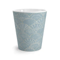 Side view of light blue seashell coffee mug showing handle and shell design