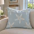 Light blue and white throw pillow featuring a starfish pattern, perfect for coastal home décor.