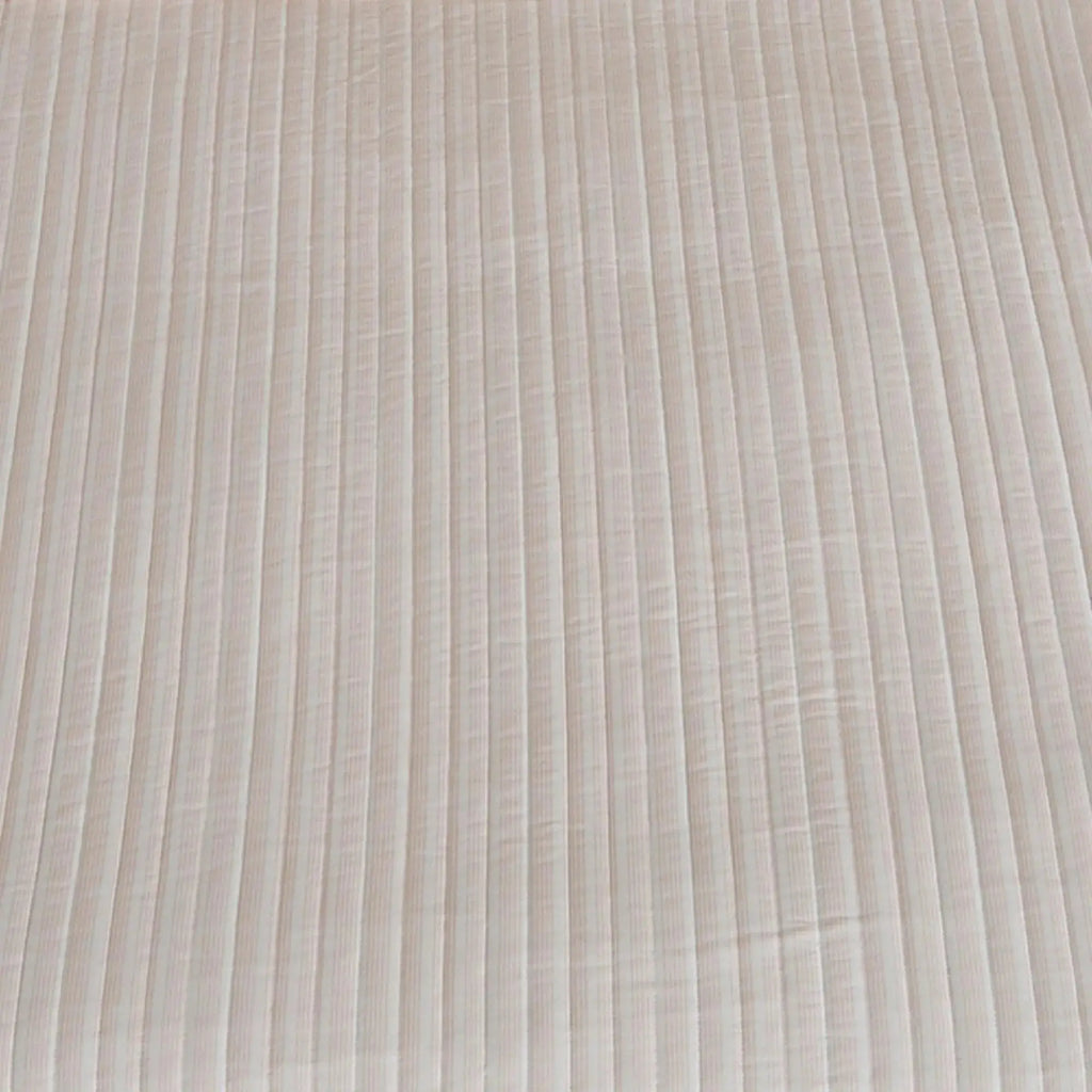 Light pink stripe quilt 3-piece set adding soft coastal color to a neutral bedroom