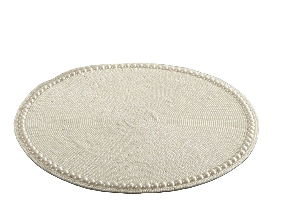 Luxury dining placemats with a decorative pearl edge for special occasions.