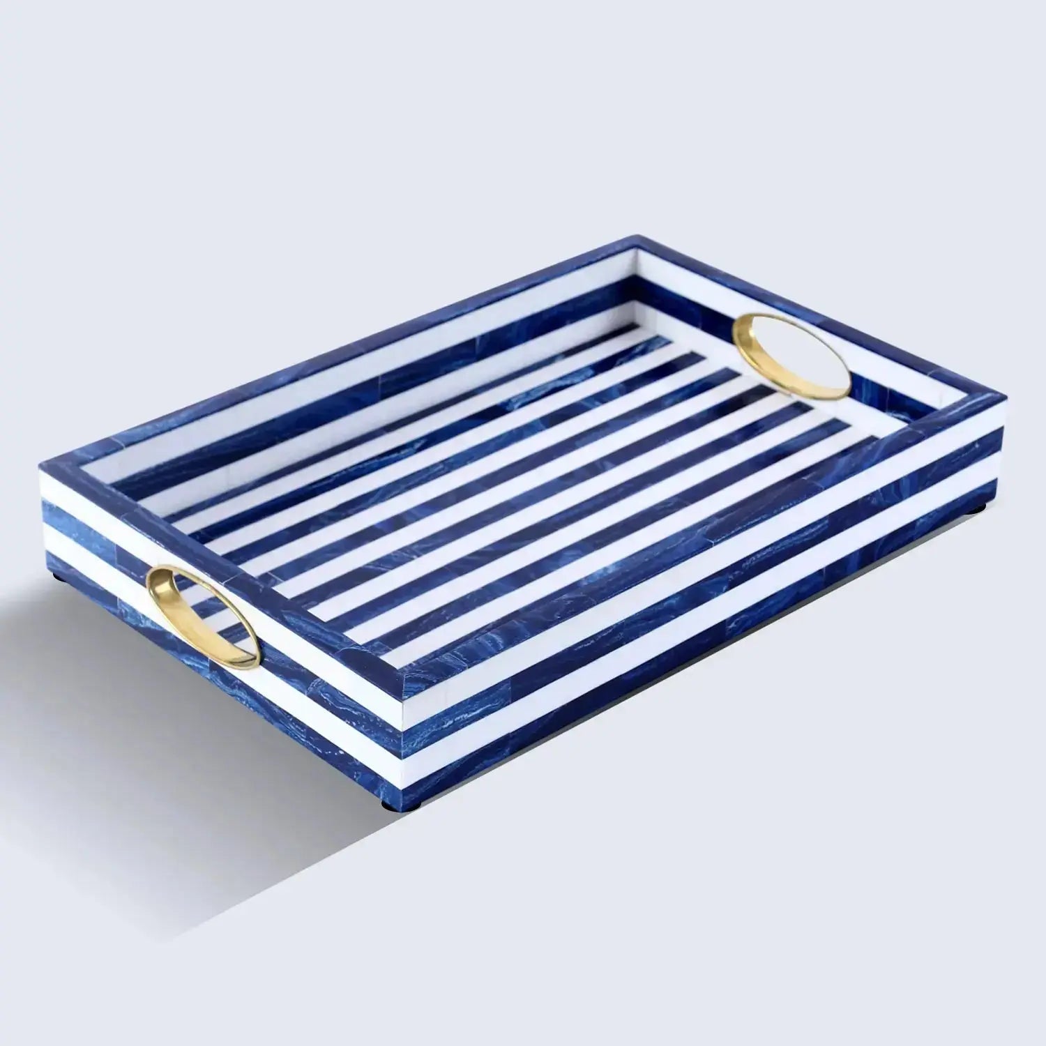 resin inlay decorative tray with brass accents on coffee table