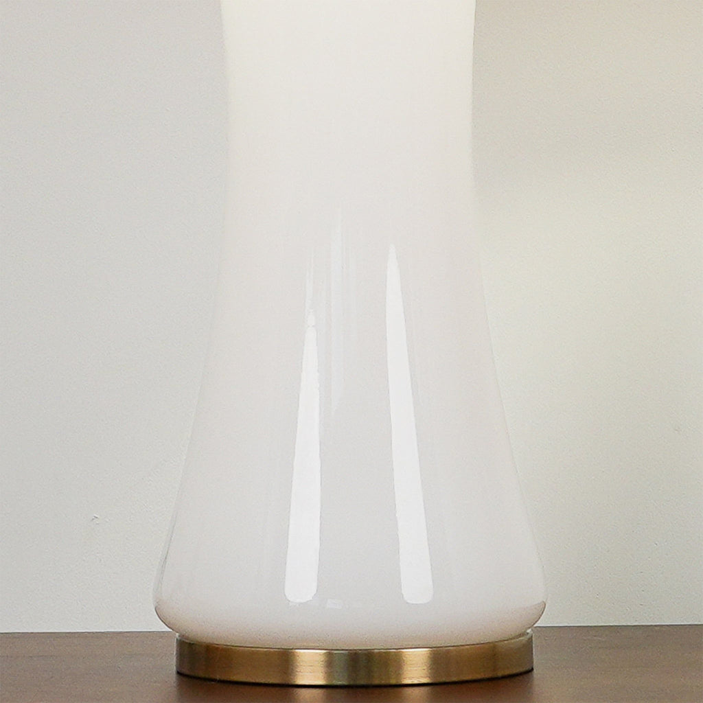 Luxury white and gold lamp styled for an elegant coastal interior.