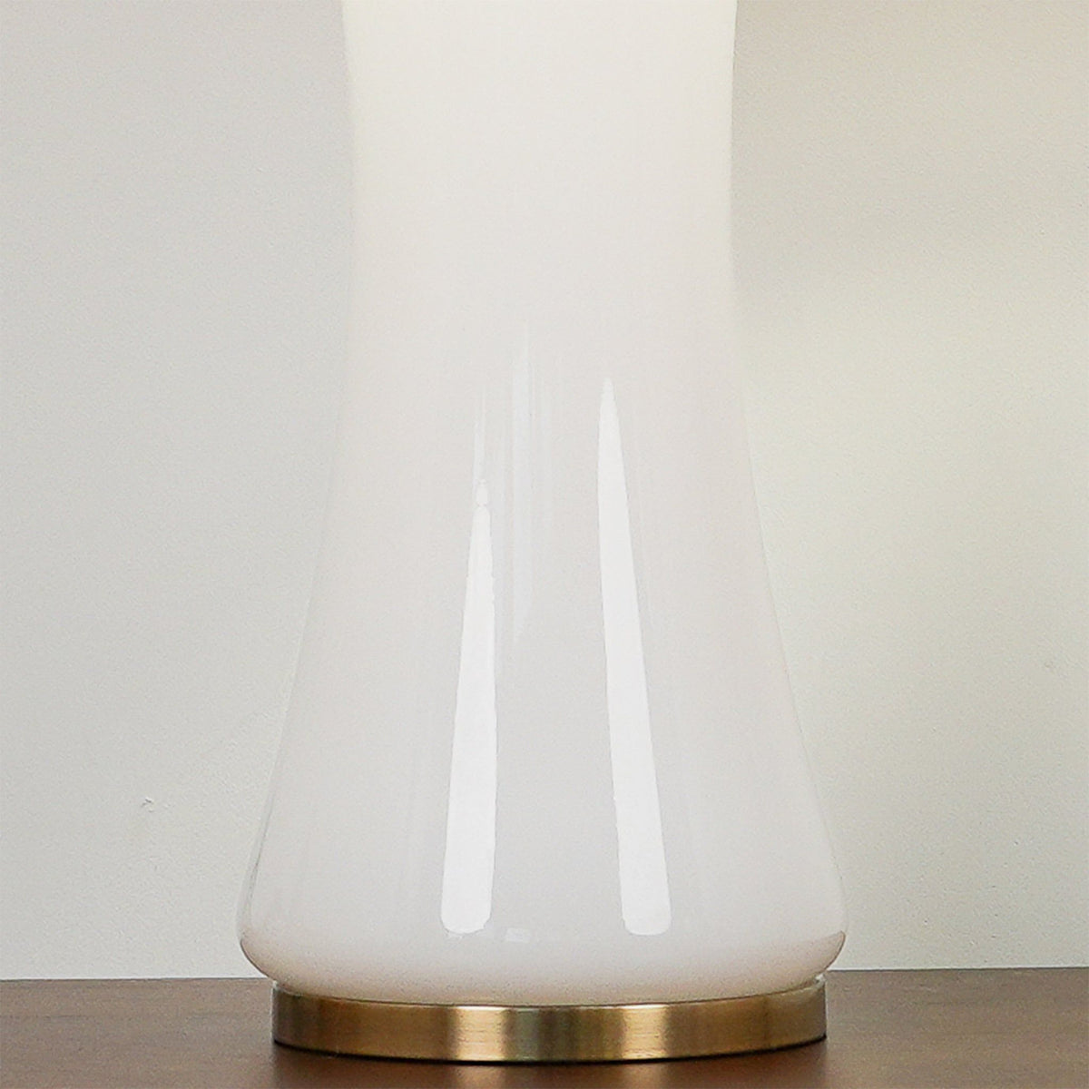 Luxury white and gold lamp styled for an elegant coastal interior.